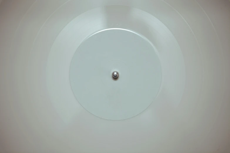 a white sink sitting under a faucet in a bathroom, an album cover, inspired by Marcel Duchamp, unsplash, conceptual art, translucent sphere, bottom view, ignant, pov from rear