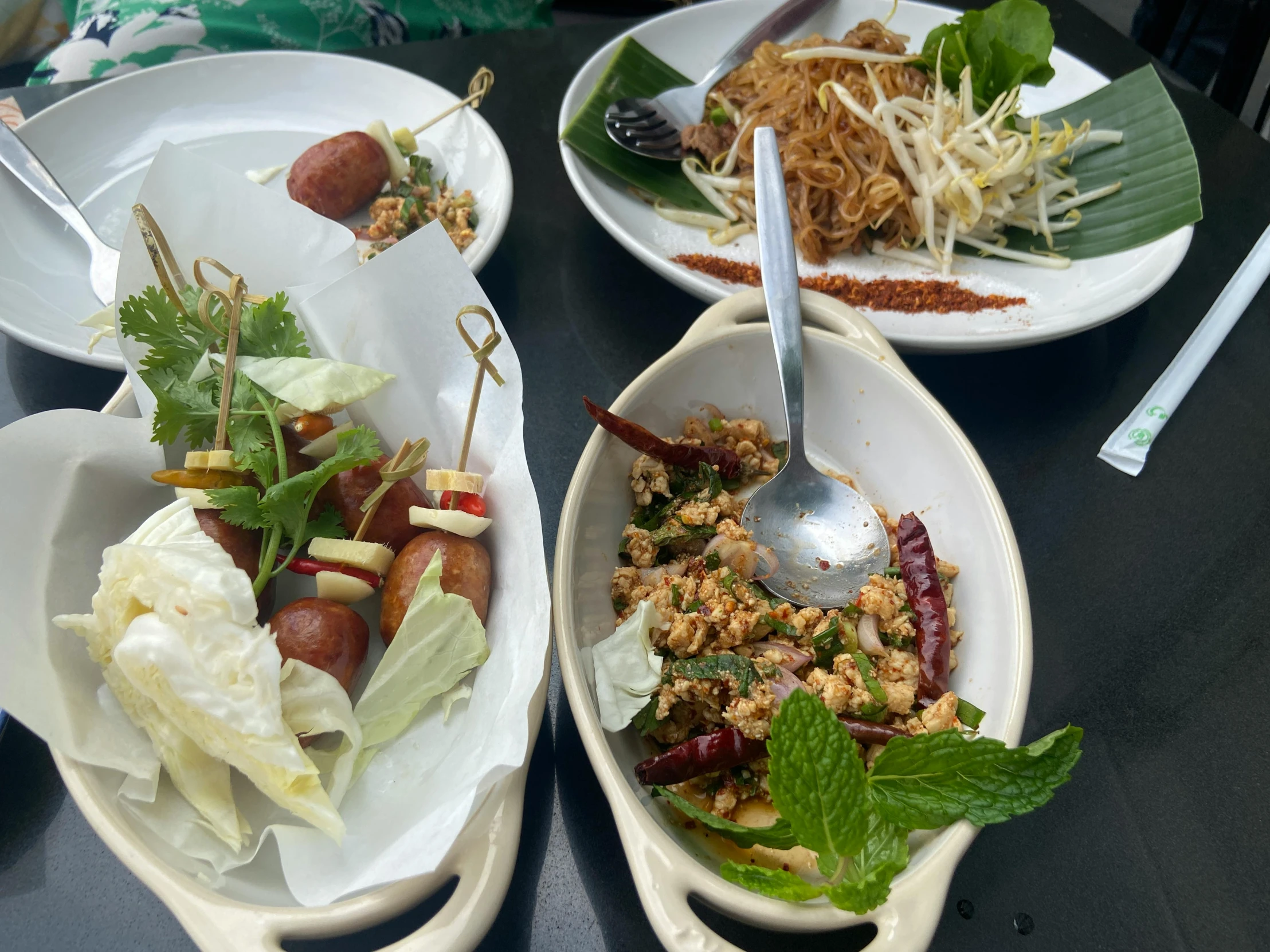 a close up of plates of food on a table, bangkok townsquare, ramps, 3 heads, botanicals