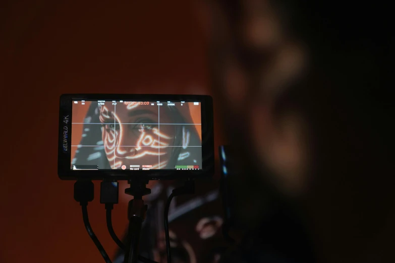 a close up of a person holding a cell phone, video art, graded with davinci resolve, looking at monitor, aorta, storyboarding