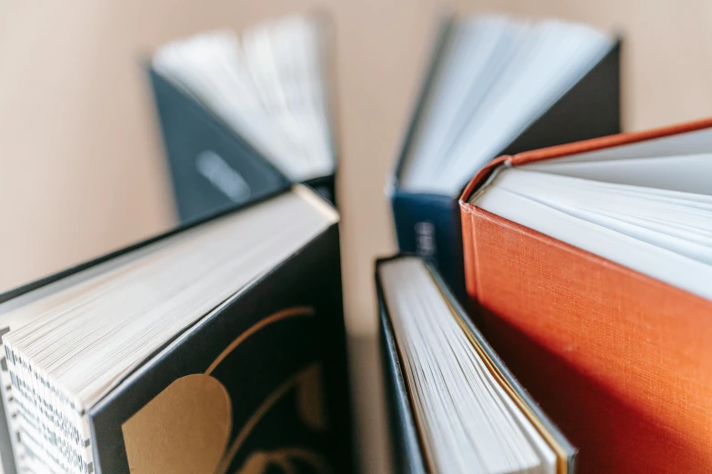 a stack of books sitting on top of a table