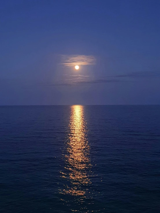 a full moon is reflected in the water, by Jan Rustem, overlooking the ocean, profile image