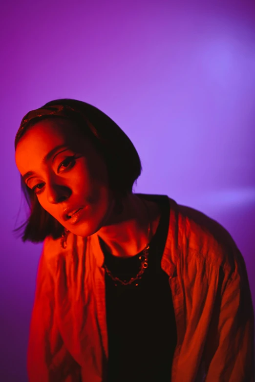 a woman standing in front of a purple light, an album cover, pexels, antipodeans, charli bowater, slightly smiling, lut, chillhop