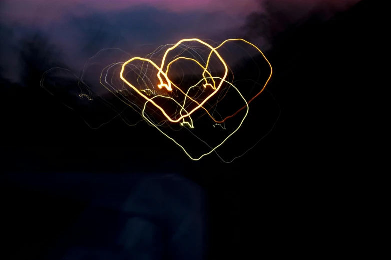a couple of lights that are in the shape of a heart, pexels, process art, scribbled, drifting, instagram photo, high exposure photo