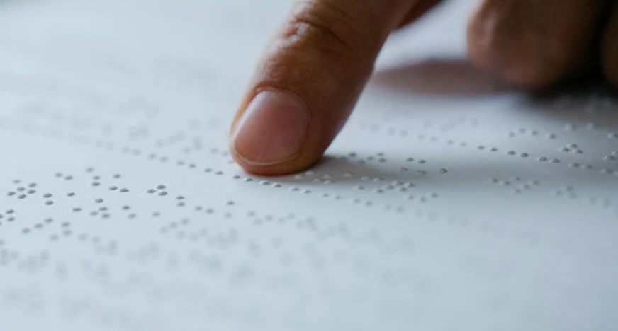 a close up of a person's finger on a sheet of paper, inspired by Vija Celmins, trending on pexels, pointillism, programming, blind, concrete poetry, signing a bill