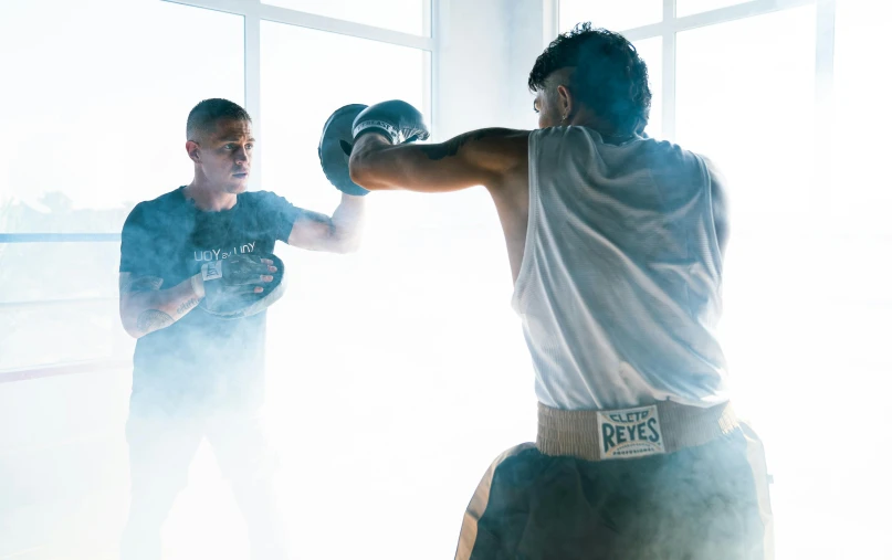 a man standing next to another man in a boxing ring, by Robbie Trevino, pexels contest winner, with backdrop of natural light, working out, profile image, pierre pellegrini and ash thorp