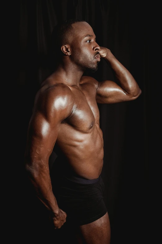 a man in a black underwear posing for a picture, inspired by Terrell James, pexels contest winner, profile image, chocolate. rugged, flexing, grey skinned