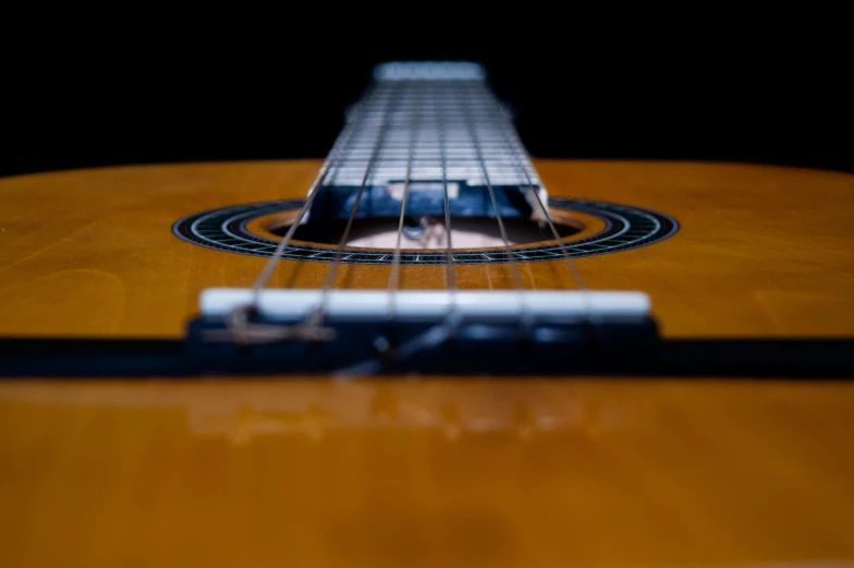 a close up of a guitar on a black background, pexels contest winner, fan favorite, rectangle, strings, plain background
