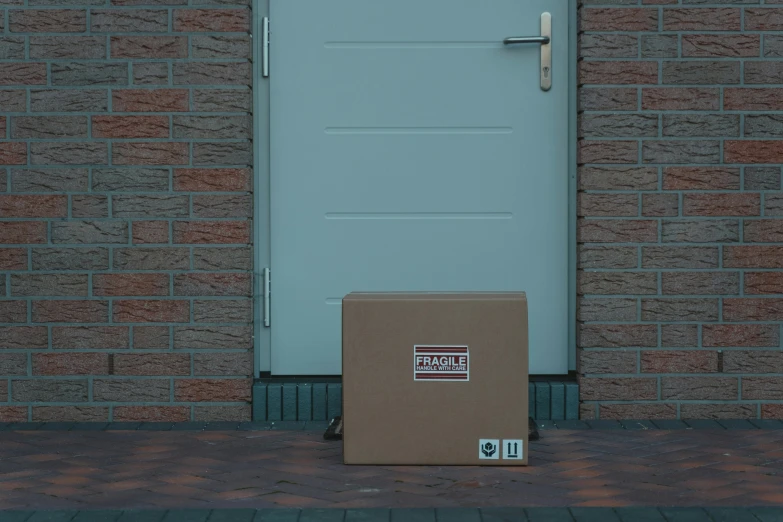 a cardboard box sitting in front of a door, detailed product image, delivering parsel box, mysterious exterior, loish van baarle
