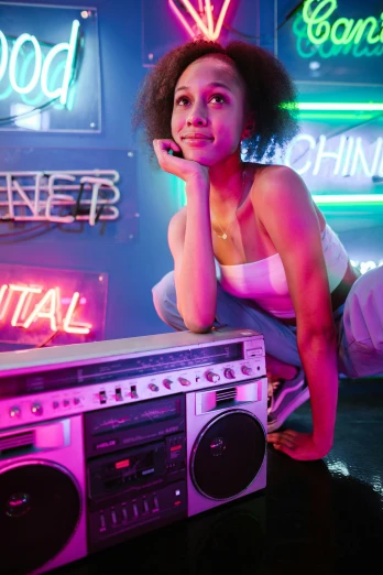 a woman leaning on a boombox in front of neon signs, trending on pexels, nathalie emmanuel, industrial party, girl in studio, white neon lighting