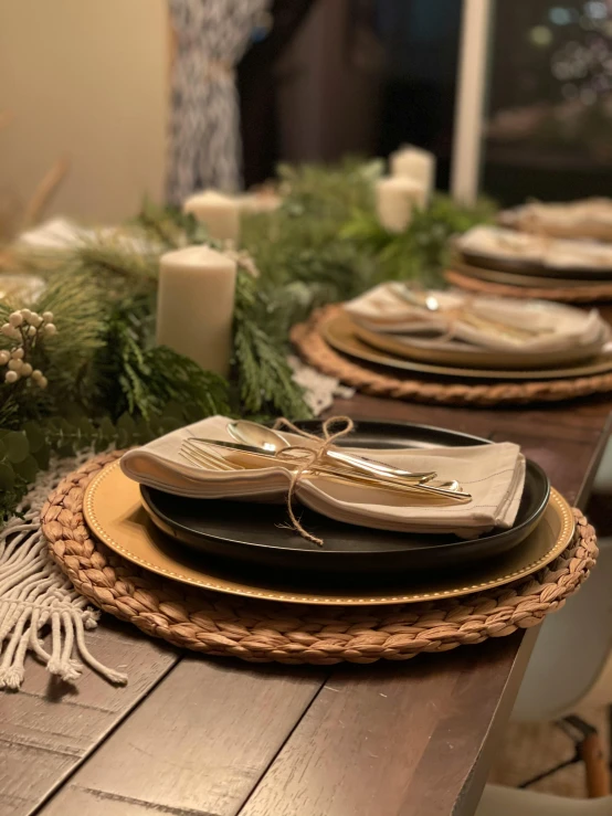 a wooden table topped with plates and silverware, instagram, christmas night, black and gold wires, profile image, angled shot