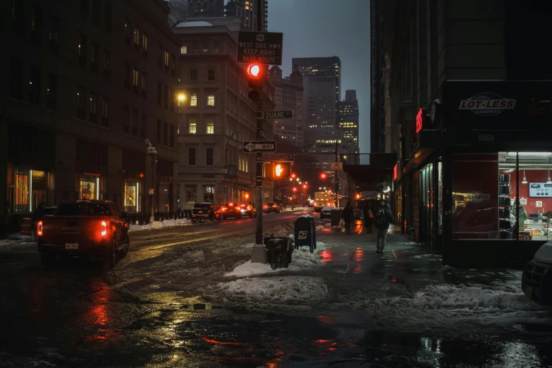 a city street filled with lots of traffic at night, inspired by Elsa Bleda, pexels contest winner, realism, winter storm, new york back street, city morning, humid evening