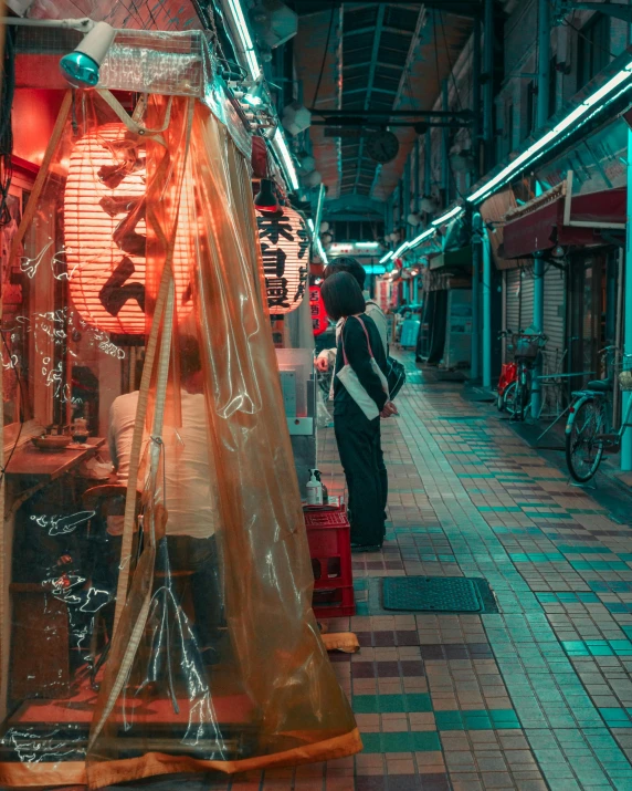 a man standing in front of a store covered in plastic, inspired by Liam Wong, unsplash contest winner, girl under lantern, shady alleys, 8 k photo, taken in the early 2020s