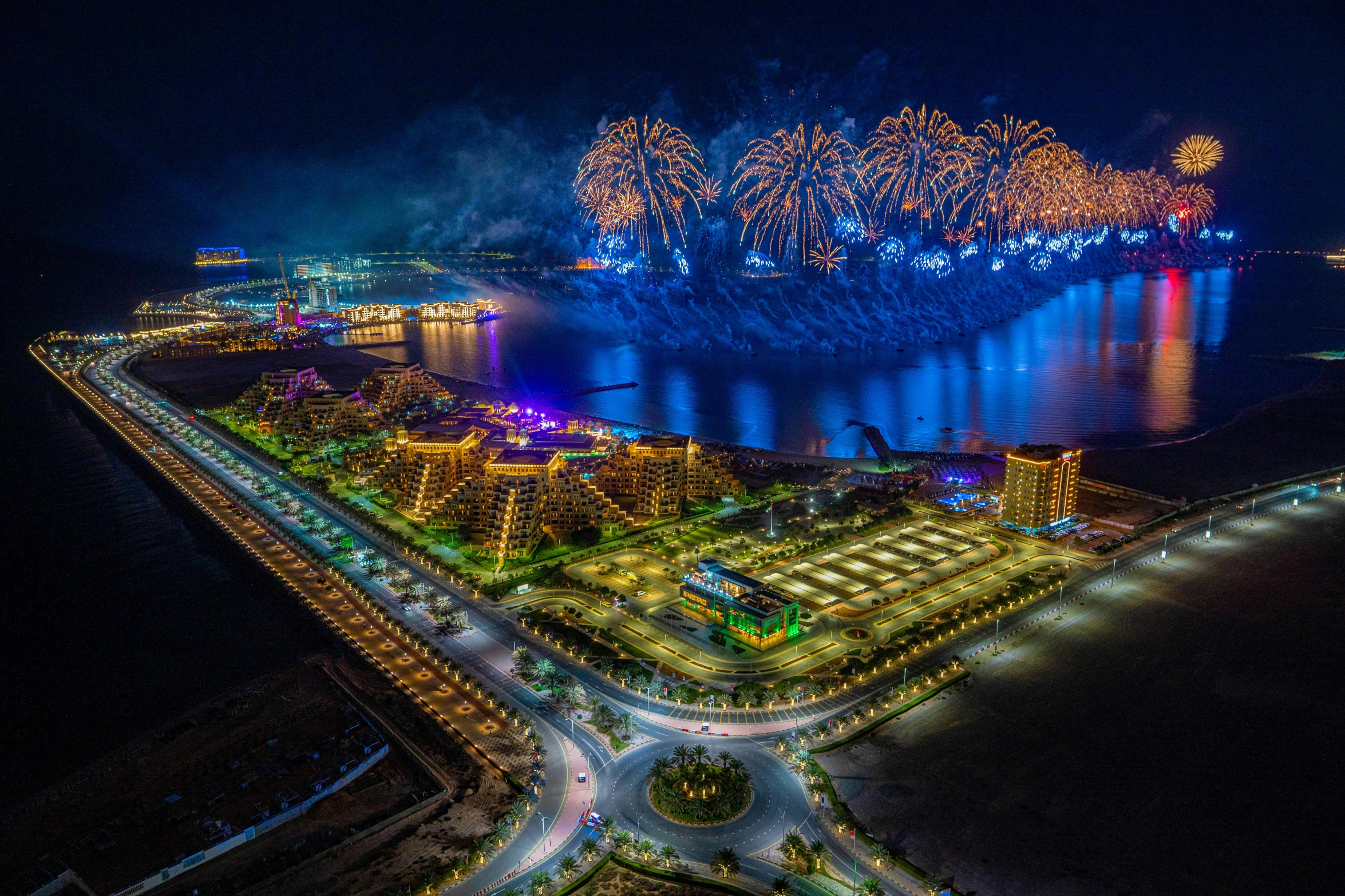 fireworks in the sky over a large body of water, by Abdullah Gërguri, pexels contest winner, award arhitectural photography, arabian night, vincent callebaut, birds - eye view