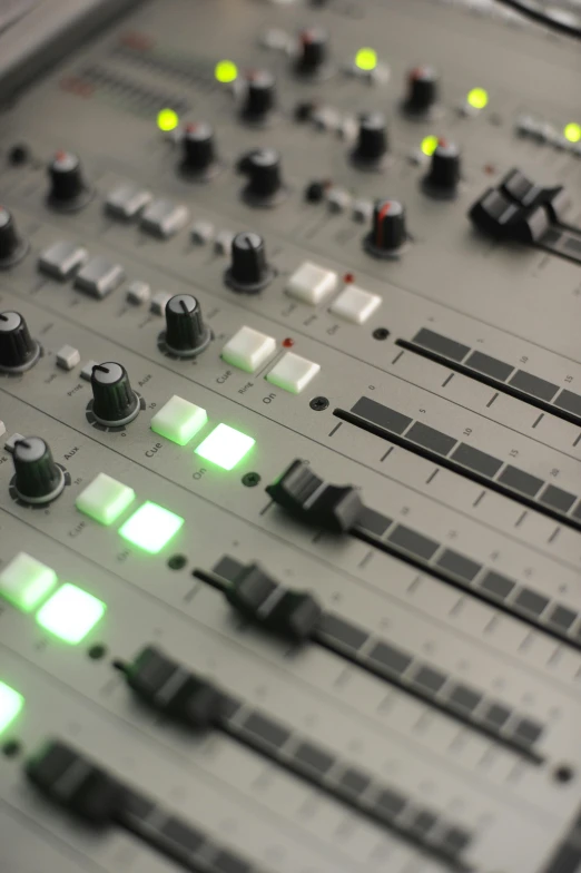 a close up of a sound board with green lights, an album cover, bauhaus, studio orange, radio equipment, thumbnail, commercial photograph