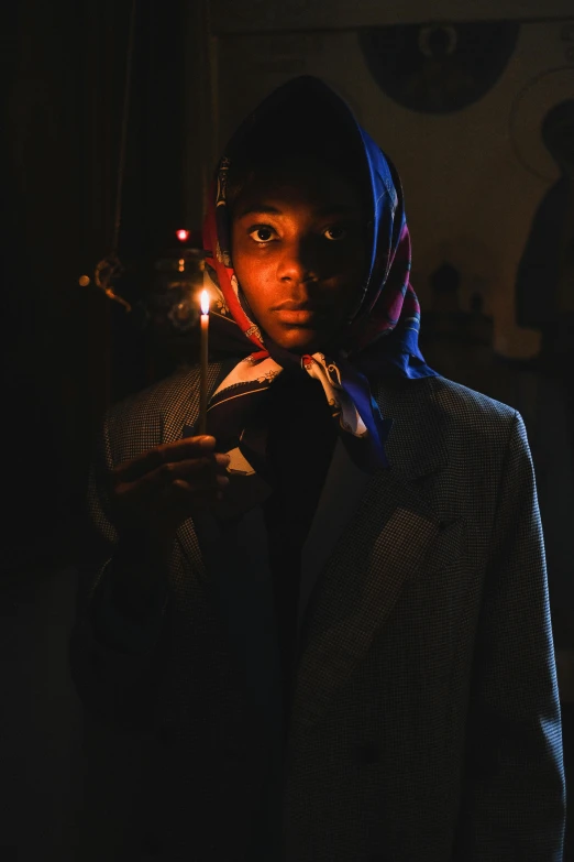 a woman holding a lit candle in a dark room, inspired by Gordon Parks, 14 yo berber boy, african cyberpunk wizards, slide show, ignant