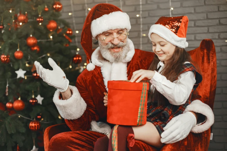 a little girl sitting in a chair next to a santa clause, pexels, avatar image, ladies, pleasing, wearing festive clothing