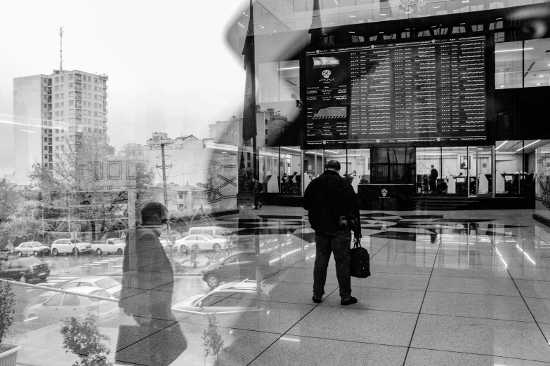 a couple of people that are standing in front of a building, a poster, by Emma Andijewska, pexels contest winner, full of glass. cgsociety, bus station, people at work, back and white