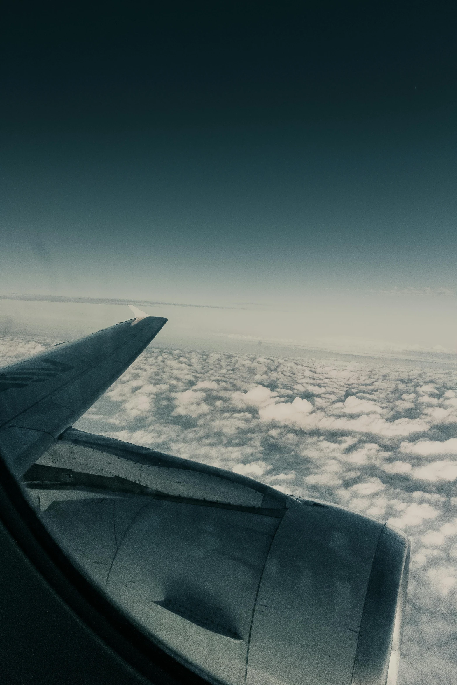 a view of the wing of an airplane above the clouds, unsplash, low quality footage, gopro photo