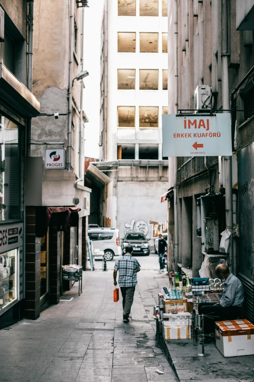 a man walking down a narrow city street, pexels contest winner, mingei, fallout style istanbul, inspect in inventory image, tokyo izakaya scene, split near the left