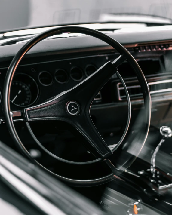 a close up of a steering wheel and dashboard of a car, an album cover, by Carey Morris, trending on unsplash, square, mercedes, black color scheme, seventies