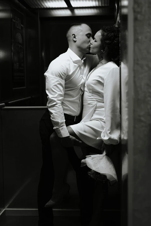 a man and a woman kissing in an elevator, inspired by Jerry Schatzberg, pexels contest winner, renaissance, clothed in white shirt, sexy pose, dark and white, high deatil