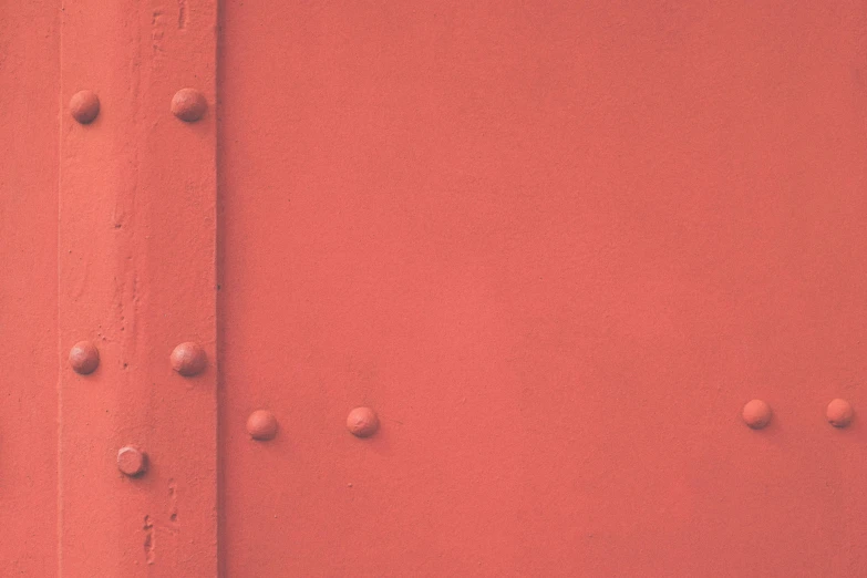 a close up of a red wall with rivets, unsplash, postminimalism, boxcar on the railroad, instagram post, pale red, red dot