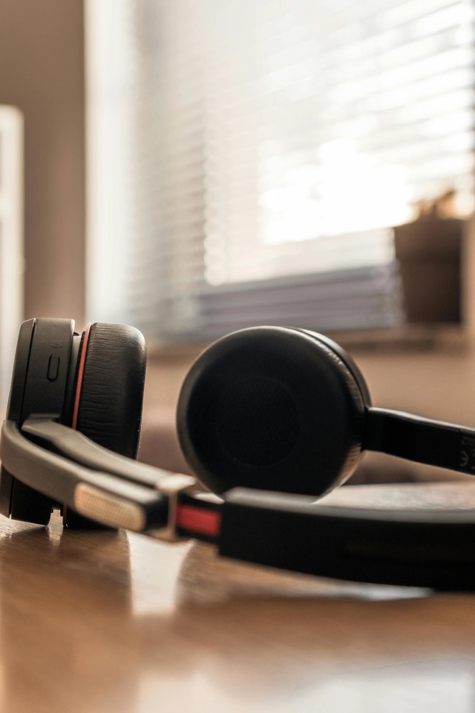 a pair of headphones sitting on top of a wooden table, a picture, shutterstock, bauhaus, in an call centre office, medium close-up shot, multiple stories, vibration