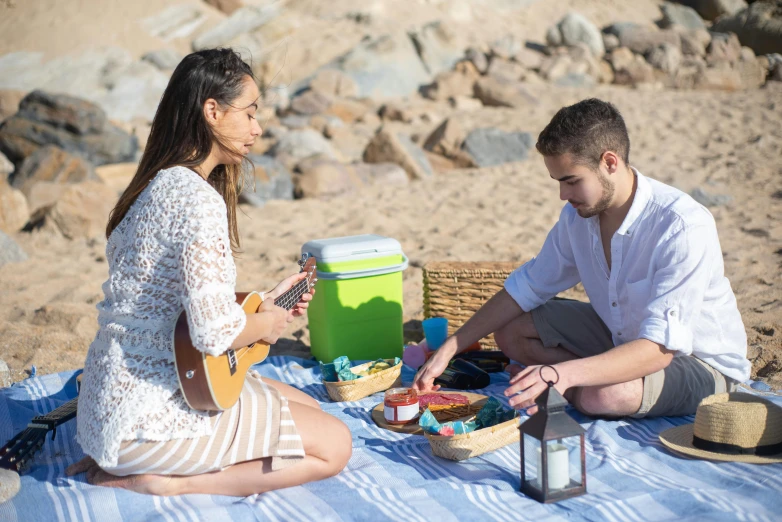 a man and woman having a picnic on the beach, unsplash, instrument, unedited, full shot photograph, handsome