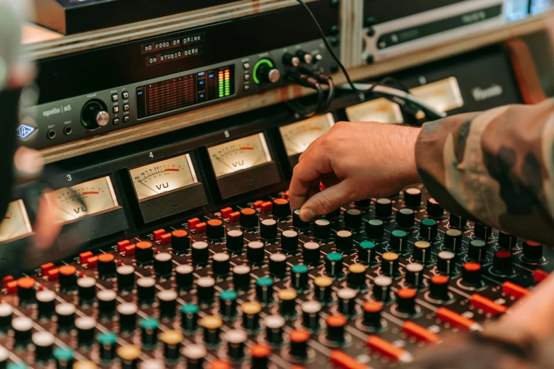 a close up of a person in a recording studio, console, instagram post, restoration, multicoloured