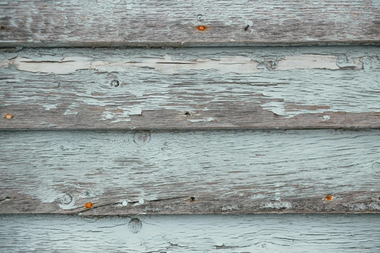 a close up of a wooden wall with peeling paint, inspired by Agnes Martin, unsplash, pale cyan and grey fabric, background image, modeled, wooden houses