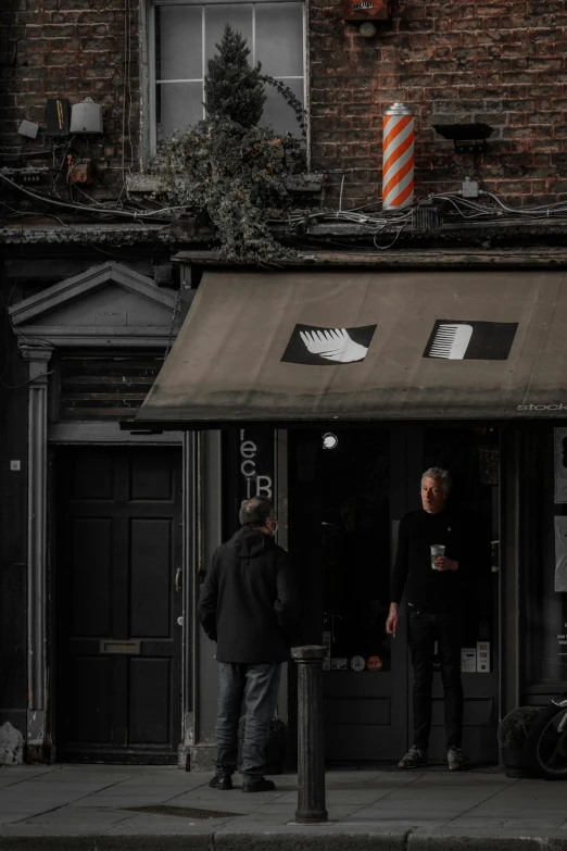 a group of men standing outside of a barber shop, by Thomas Wijck, pexels contest winner, renaissance, location of a dark old house, gif, awnings, ismail inceoglu and ruan jia