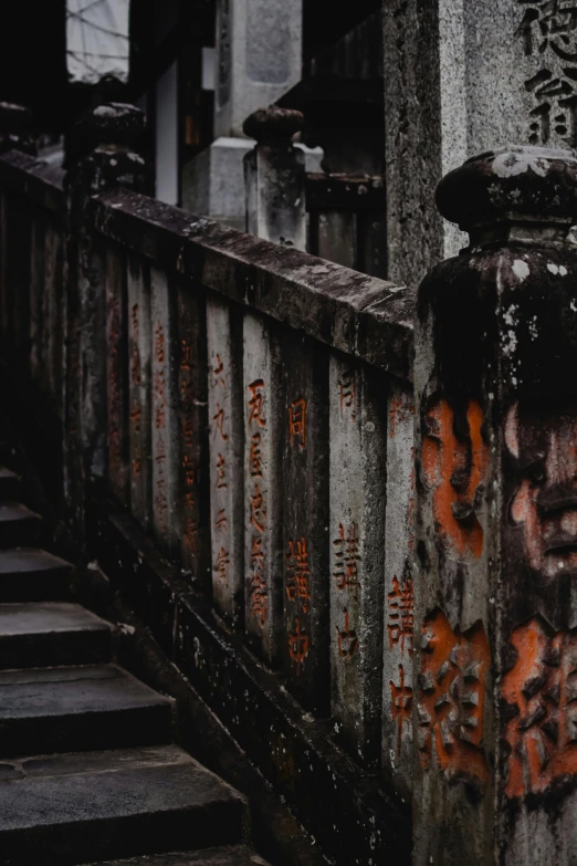 a close up of a building with graffiti on it, inspired by Torii Kiyomoto, pexels contest winner, dark graveyard scene, wooden bridge, vietnamese temple scene, grey orange