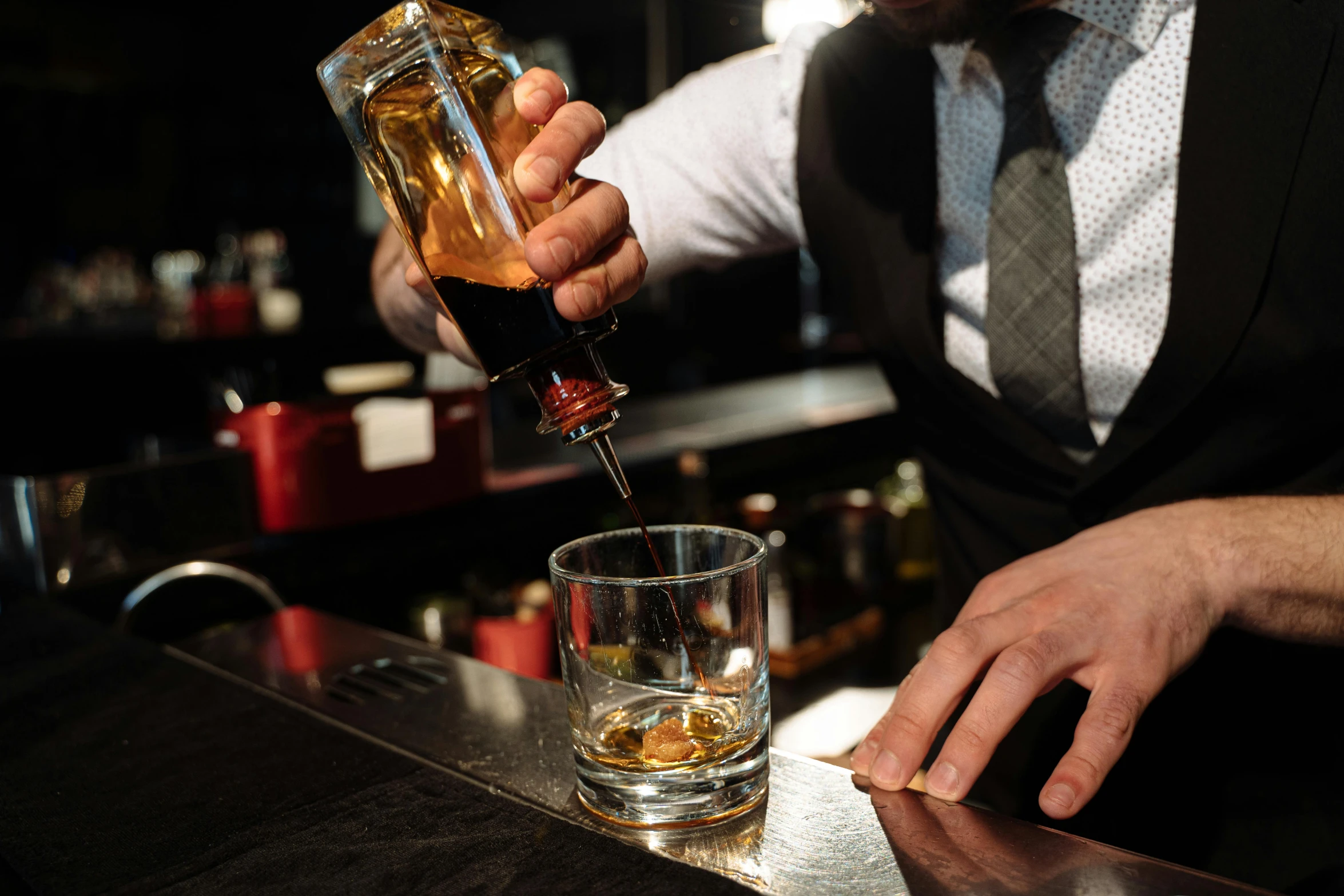 a man pouring a drink into a glass, fancy whiskey bottle, melbourne, highly upvoted, uploaded