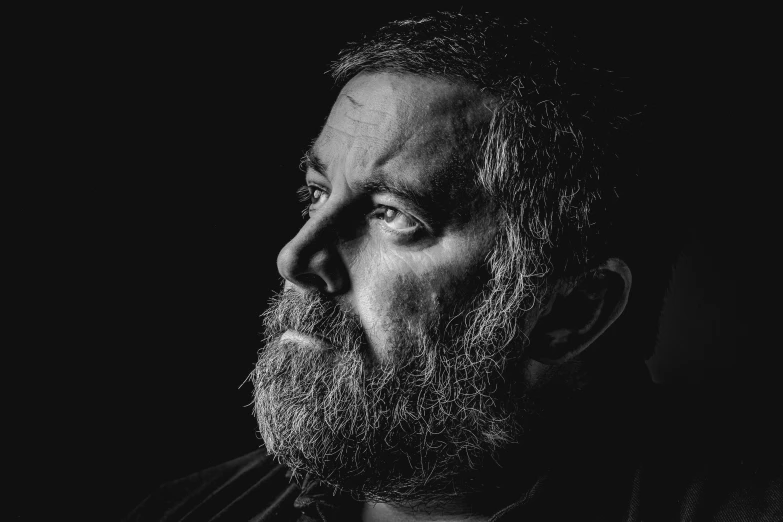 a black and white photo of a man with a beard, a character portrait, pexels, digital art, slavoj zizek, neal adams | portrait, color portrait, rowan atkinson