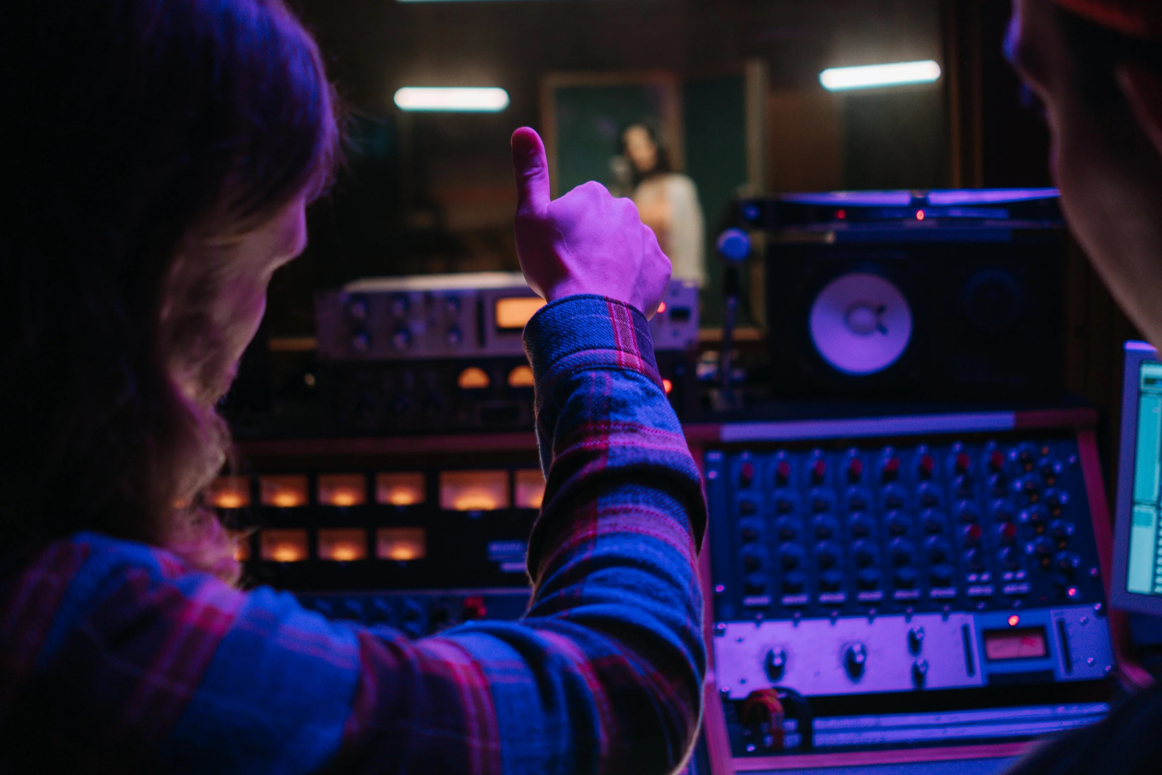 a man and a woman in a recording studio, an album cover, inspired by Elsa Bleda, trending on pexels, pointing, lo fi, high quality photo, predawn