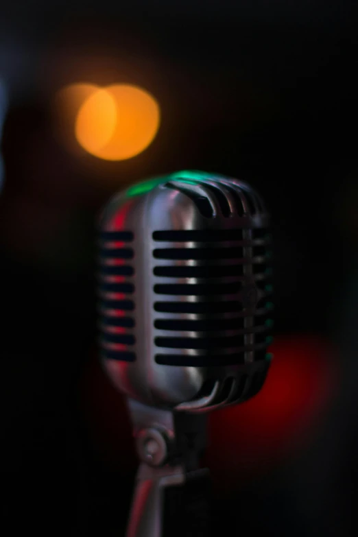a close up of a microphone with a blurry background, an album cover, by Sven Erixson, pexels, happening, night life, tall thin, 15081959 21121991 01012000 4k, various colors