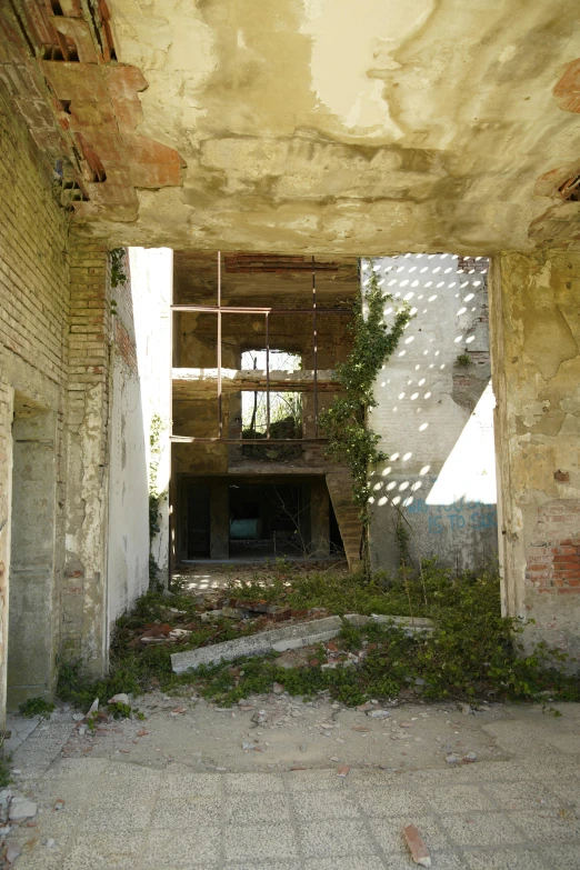 a fire hydrant sitting inside of an old building, inspired by Dionisio Baixeras Verdaguer, overgrown ruins, open ceiling, two stories, view from back