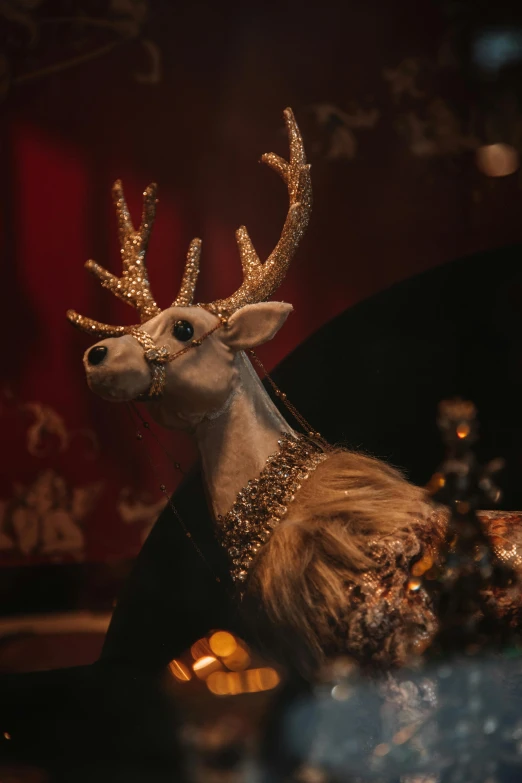 a close up of a reindeer figurine on a table, inspired by Rudolph F. Ingerle, baroque, bedazzled, framestore, and, kris kuksi