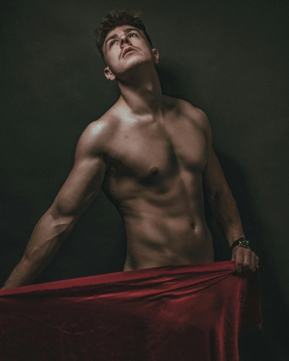 a shirtless man holding a red cloth, by Cosmo Alexander, pexels contest winner, non binary model, by :5 sexy: 7, david marquez, tight wrinkled cloath