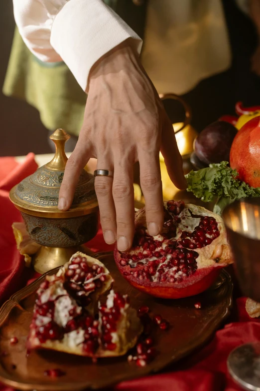 a person cutting a pomegranate on a cutting board, renaissance, displayed on an altar, elder ring, teaser, actor