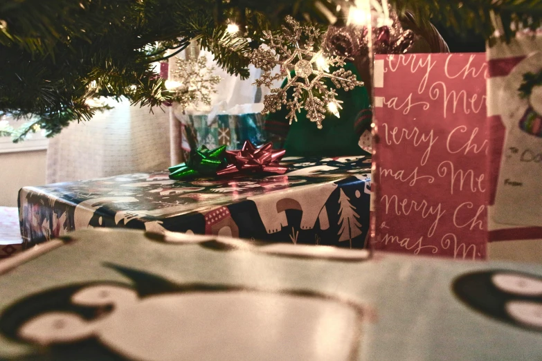 a close up of presents under a christmas tree, a photo, pexels, graffiti, print, multiple stories, max dennison, a green