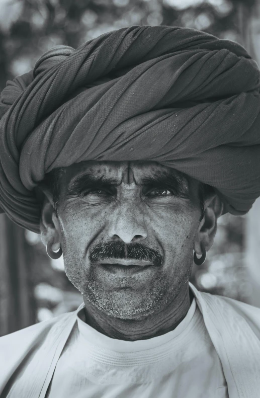 a black and white photo of a man wearing a turban, by Rajesh Soni, details faces, color photograph portrait 4k, farmer, taken in the late 2010s
