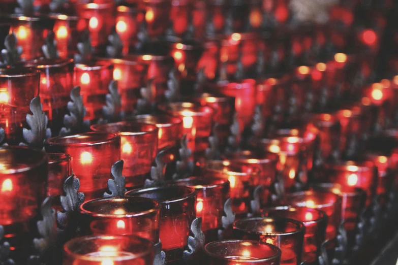 a group of red candles sitting next to each other