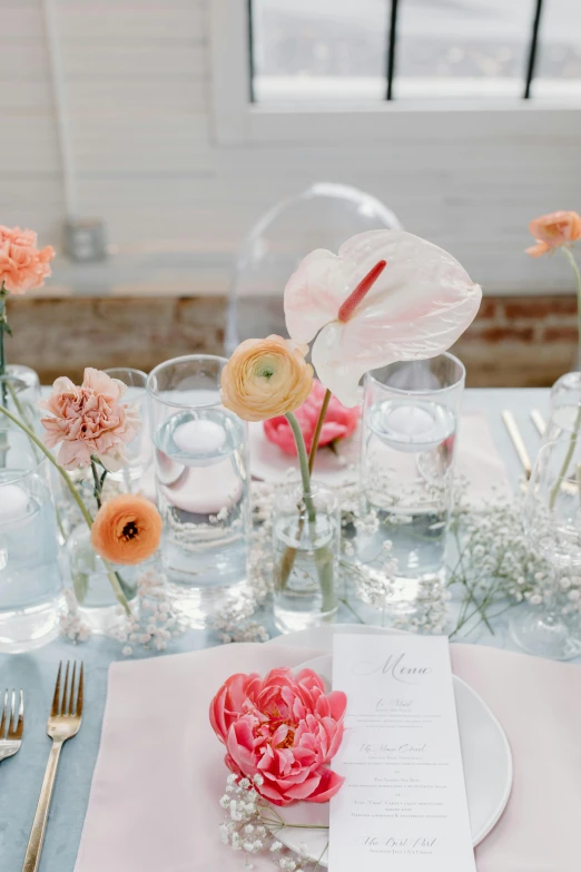 a table topped with glass vases filled with flowers, soft bright pastel, bubbly, zoomed out view, place setting