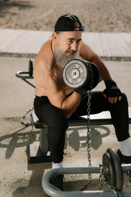 a man sitting on a bench with a barbell, pexels contest winner, renaissance, old gigachad with grey beard, 6 pack, large chain, popeye