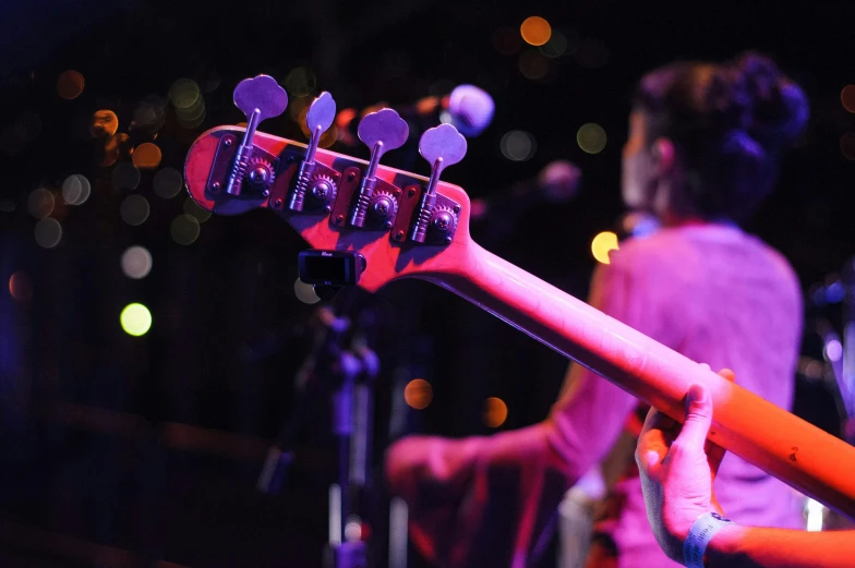 a close up of a person playing a guitar, happening, during the night, double bass, coloured, band