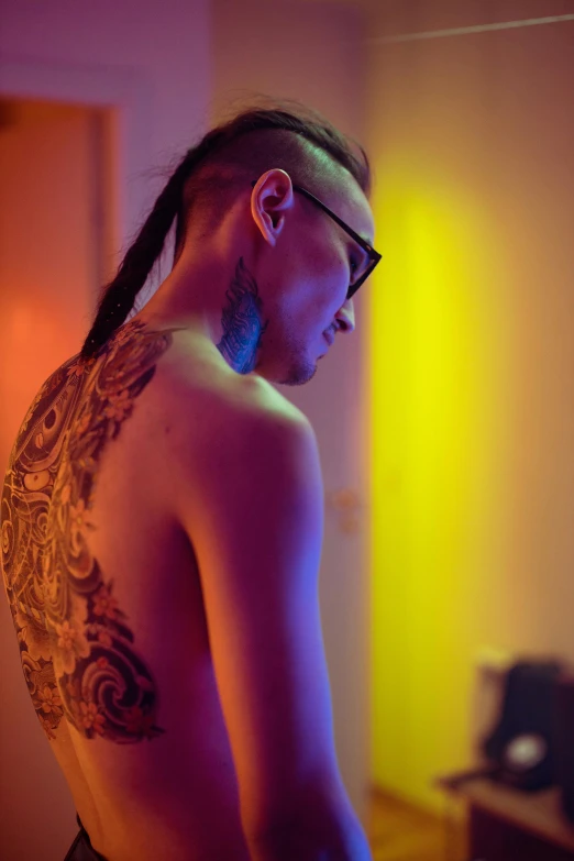 a man with a tattoo on his back, trending on pexels, colourful lighting, asian female, androgynous male, ((intricate))