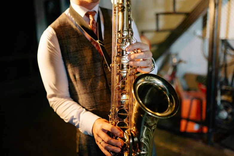 a man in a vest and tie holding a saxophone, trending on pexels, art nouveau, 15081959 21121991 01012000 4k, beautifully soft lit, instagram picture, brass equipment and computers