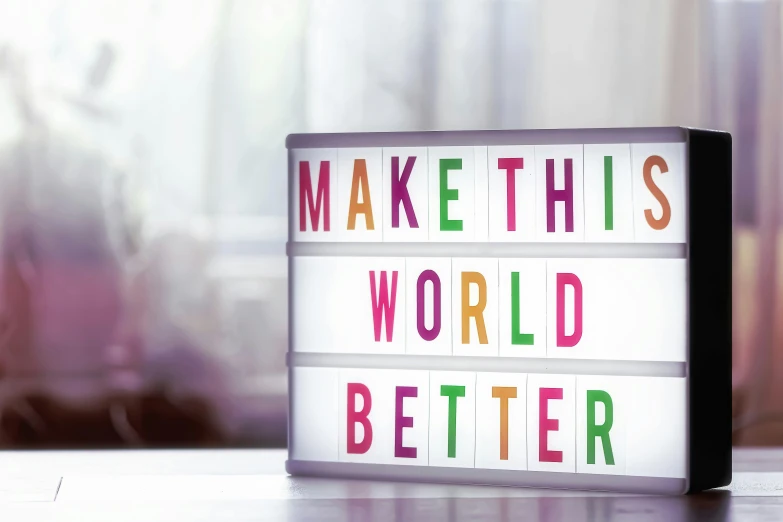 a light up sign that says make this world better, multicoloured, profile image, thumbnail, billboard image