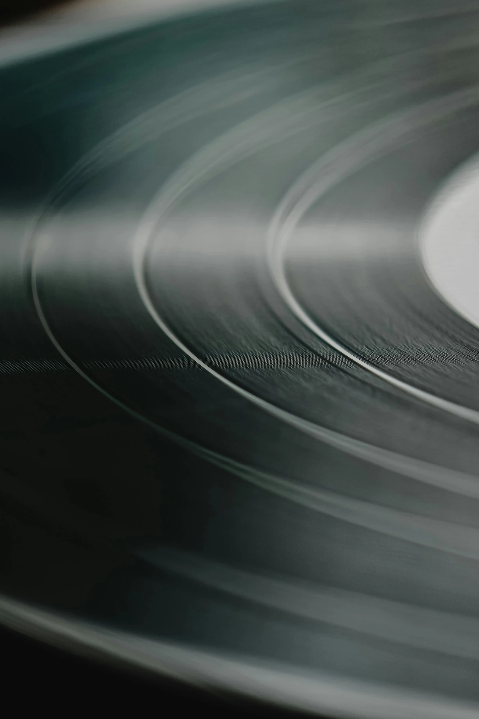 a close up of a record on a table, crisp smooth lines, promo image, desaturated, multiple stories